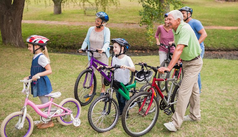 Happy family on their bike at the park